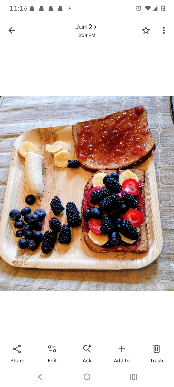 A real Jamwich loaded with blackberries, blueberries, strawberries and banana on toast